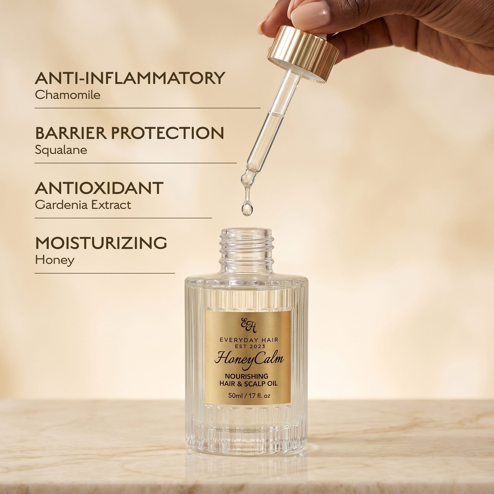 Bottle of 'Everyday Hair' Honey Calm Nourishing Hair & Scalp Oil with dropper and text highlighting ingredients.